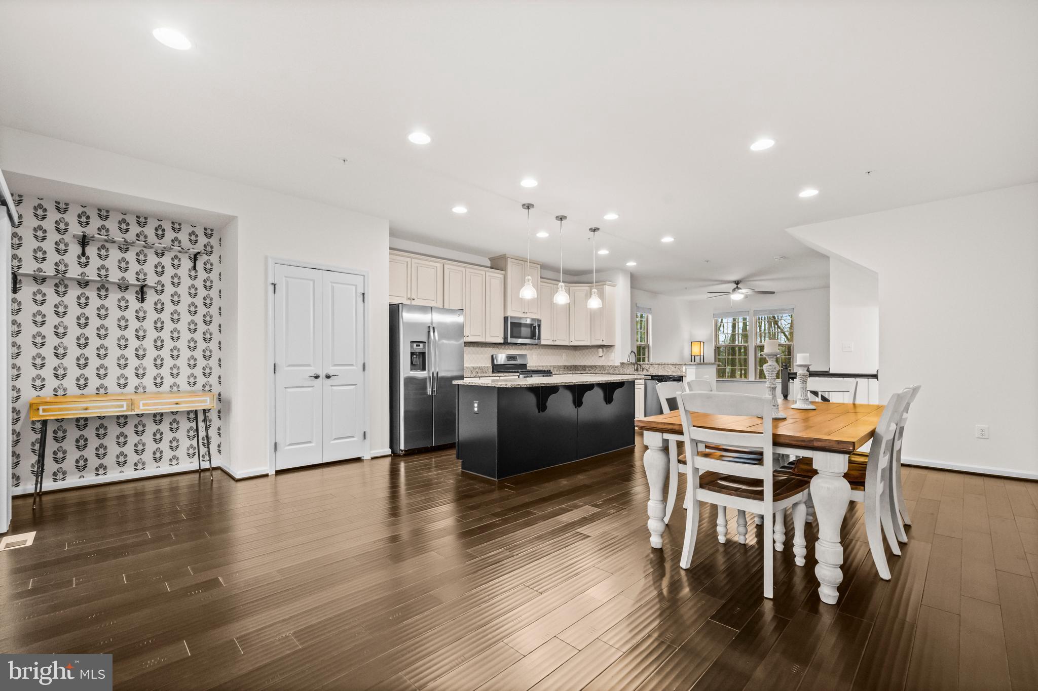 7839 Patterson Way Hanover, MD 21076 - Photo 15 of 56 a kitchen with a table and chairs in it