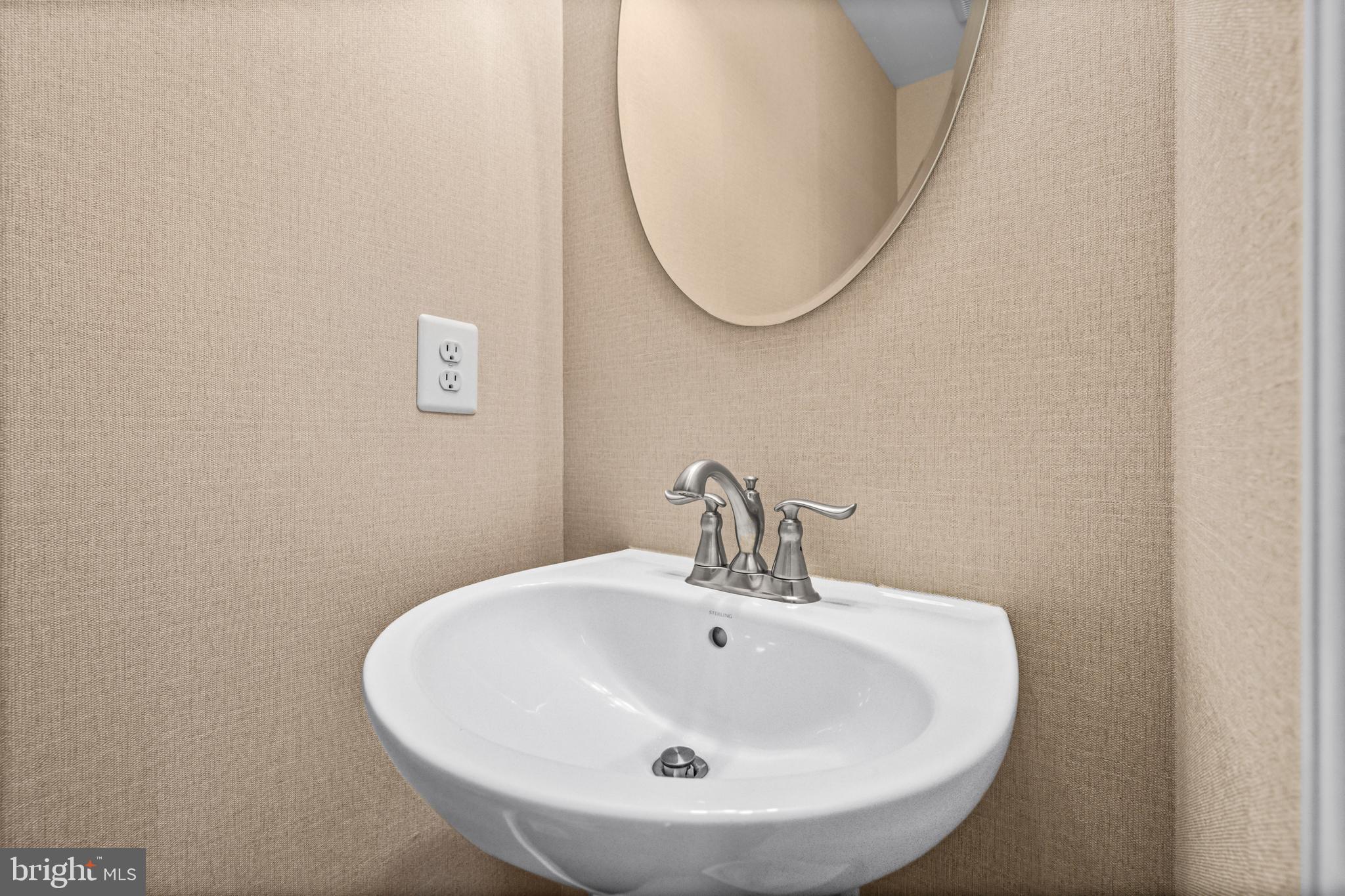 7839 Patterson Way Hanover, MD 21076 - Photo 22 of 56 a bathroom with a sink and a mirror