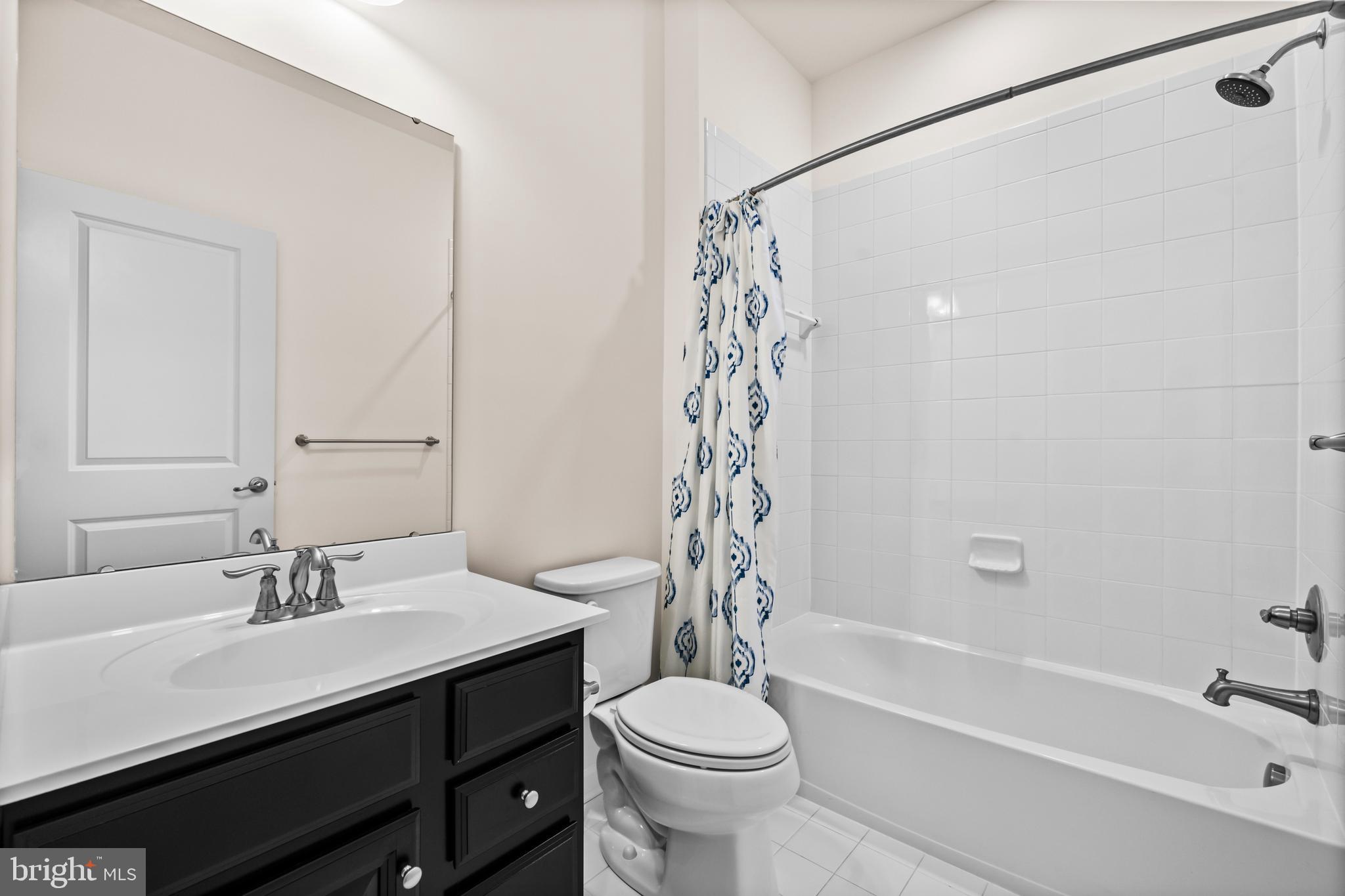 7839 Patterson Way Hanover, MD 21076 - Photo 28 of 56 a bathroom with a sink a toilet and a bathtub