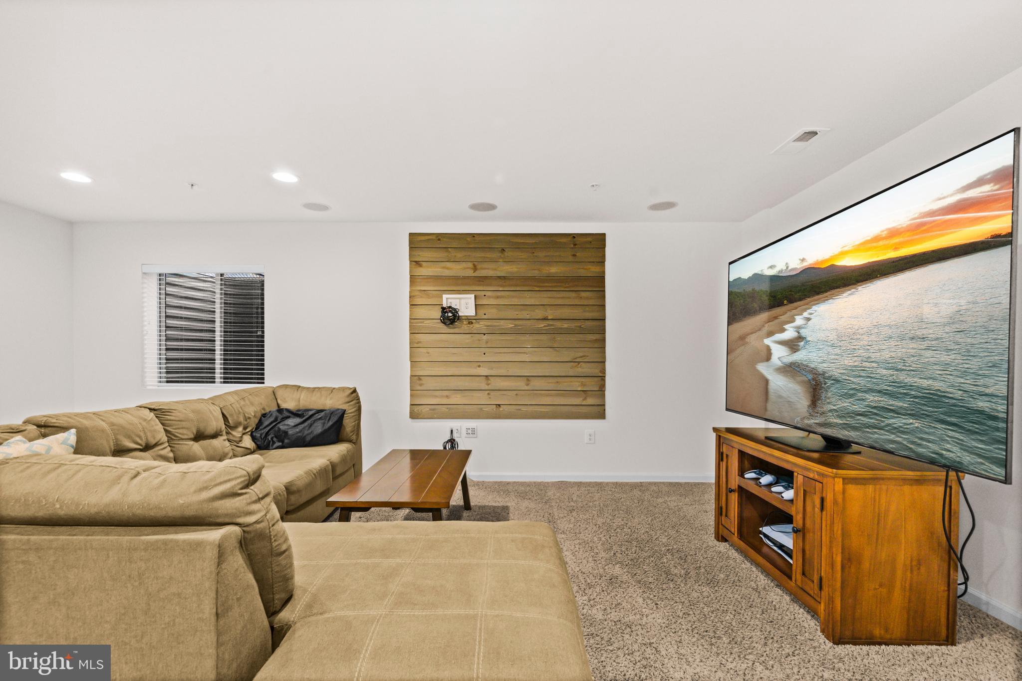 7839 Patterson Way Hanover, MD 21076 - Photo 37 of 56 a living room with furniture and a flat screen tv