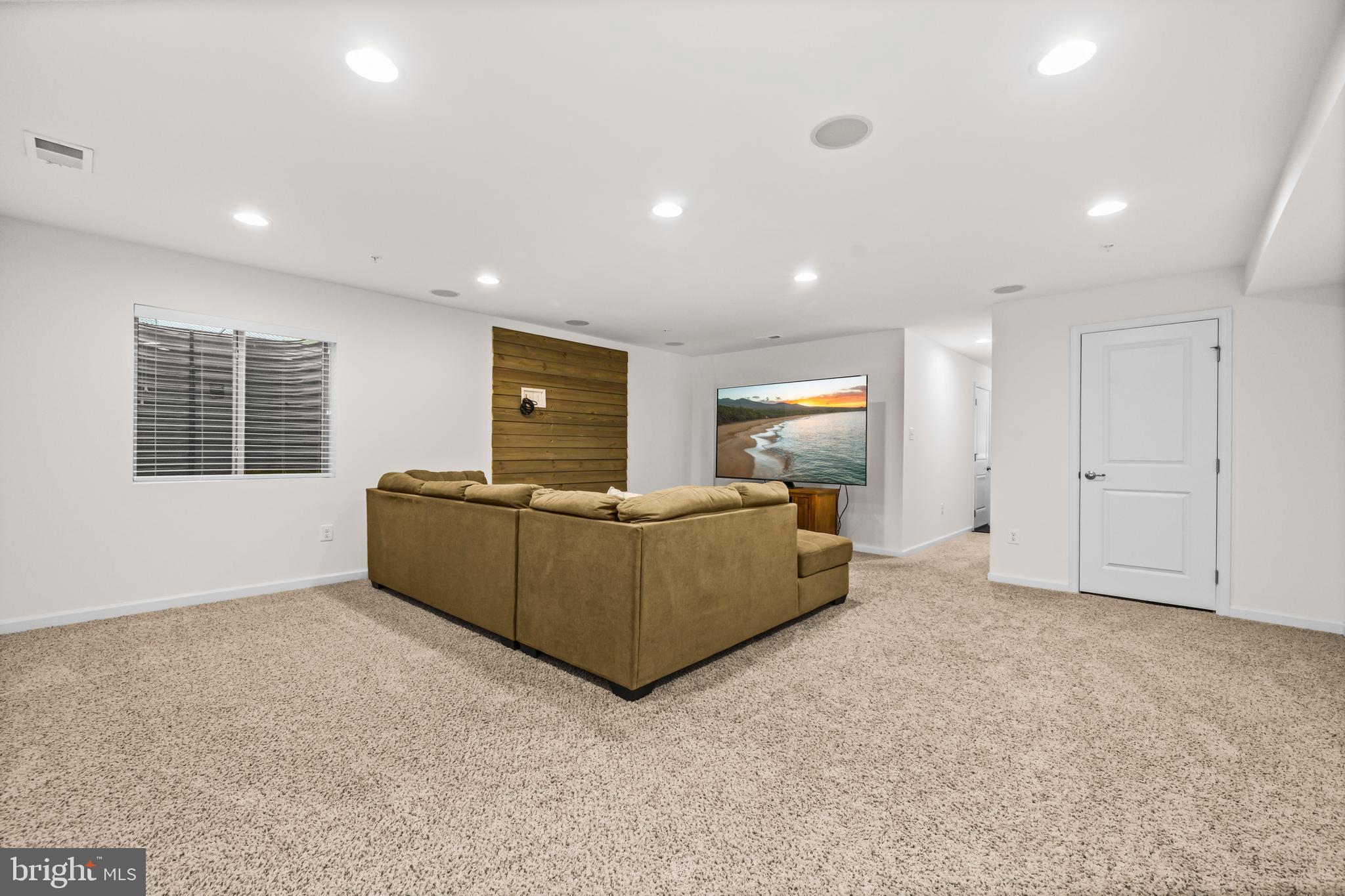 7839 Patterson Way Hanover, MD 21076 - Photo 38 of 56 a living room with furniture and a flat screen tv