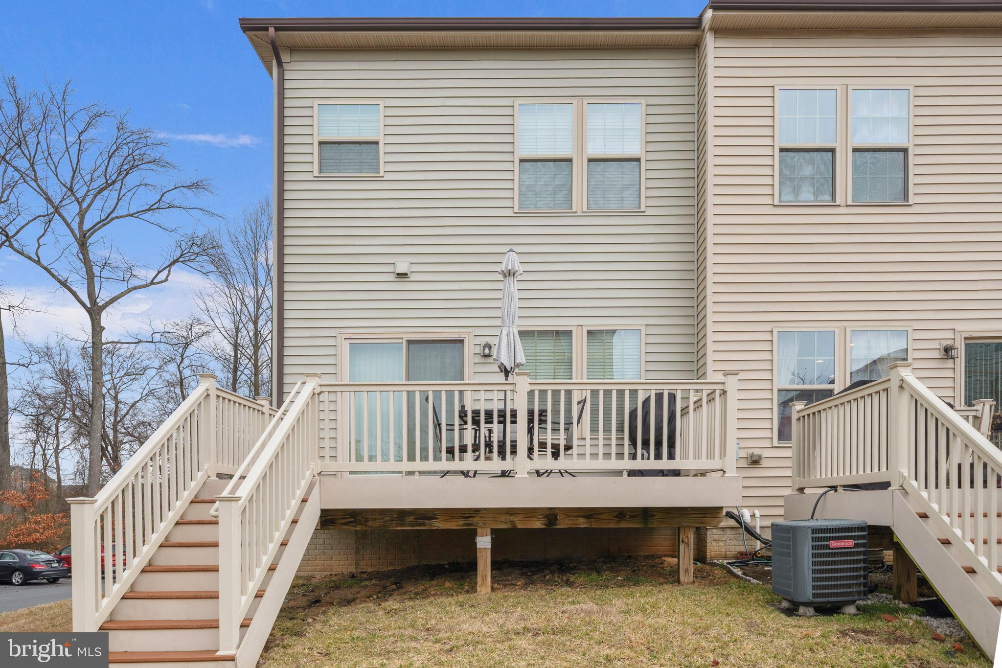 7839 Patterson Way Hanover, MD 21076 - Photo 42 of 56 a view of a house with wooden deck and furniture
