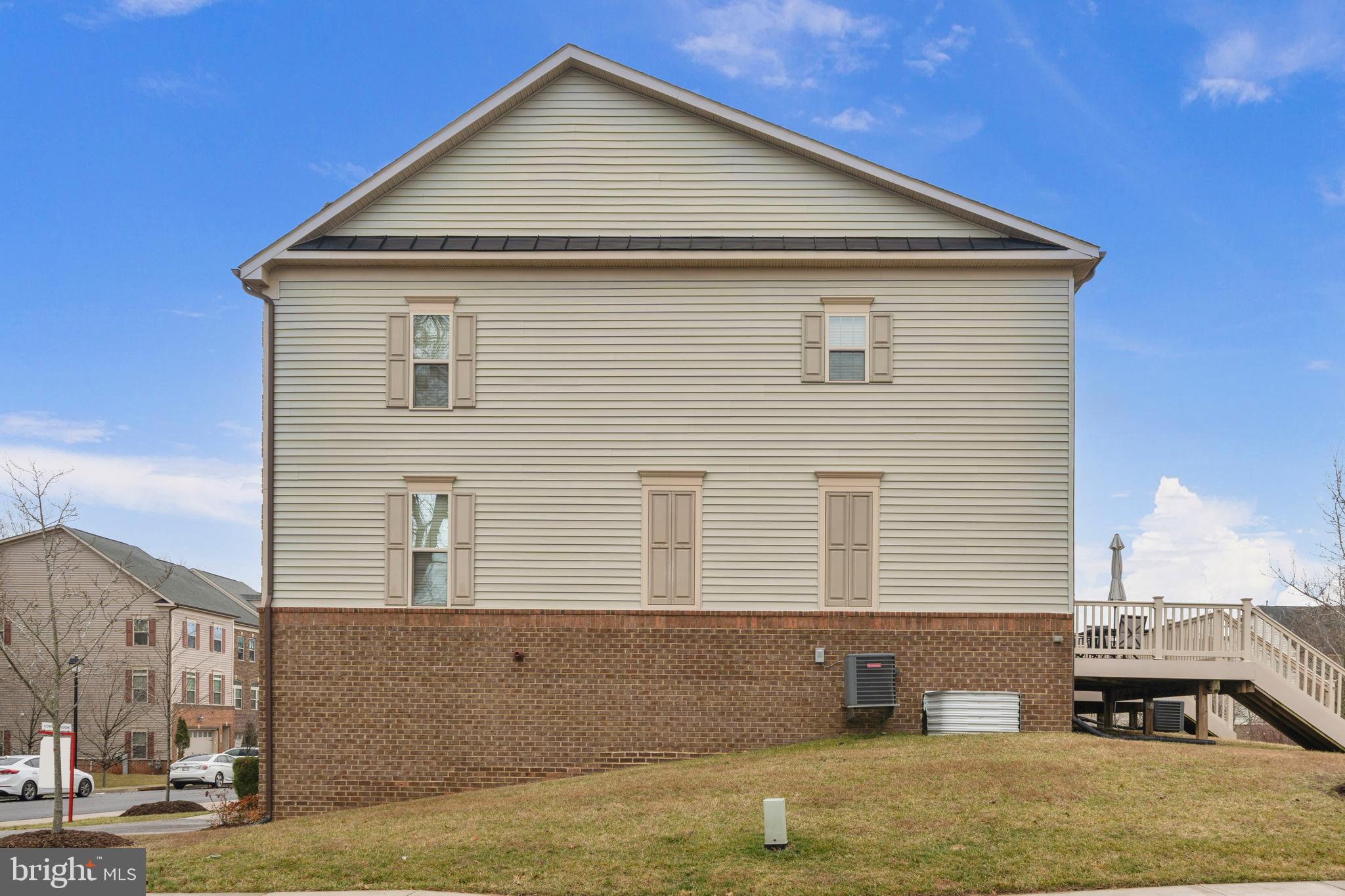 7839 Patterson Way Hanover, MD 21076 - Photo 45 of 56 a front view of a house with a yard