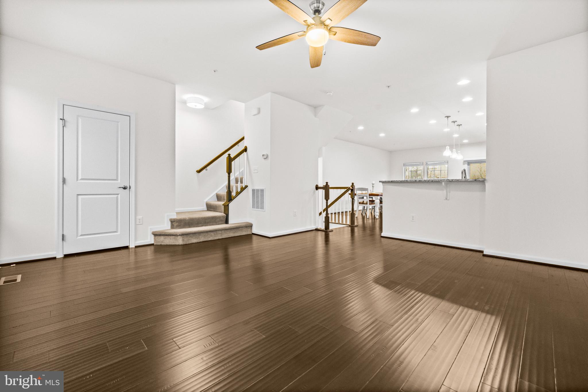 7839 Patterson Way Hanover, MD 21076 - Photo 8 of 56 a view of a room with wooden floor and staircase