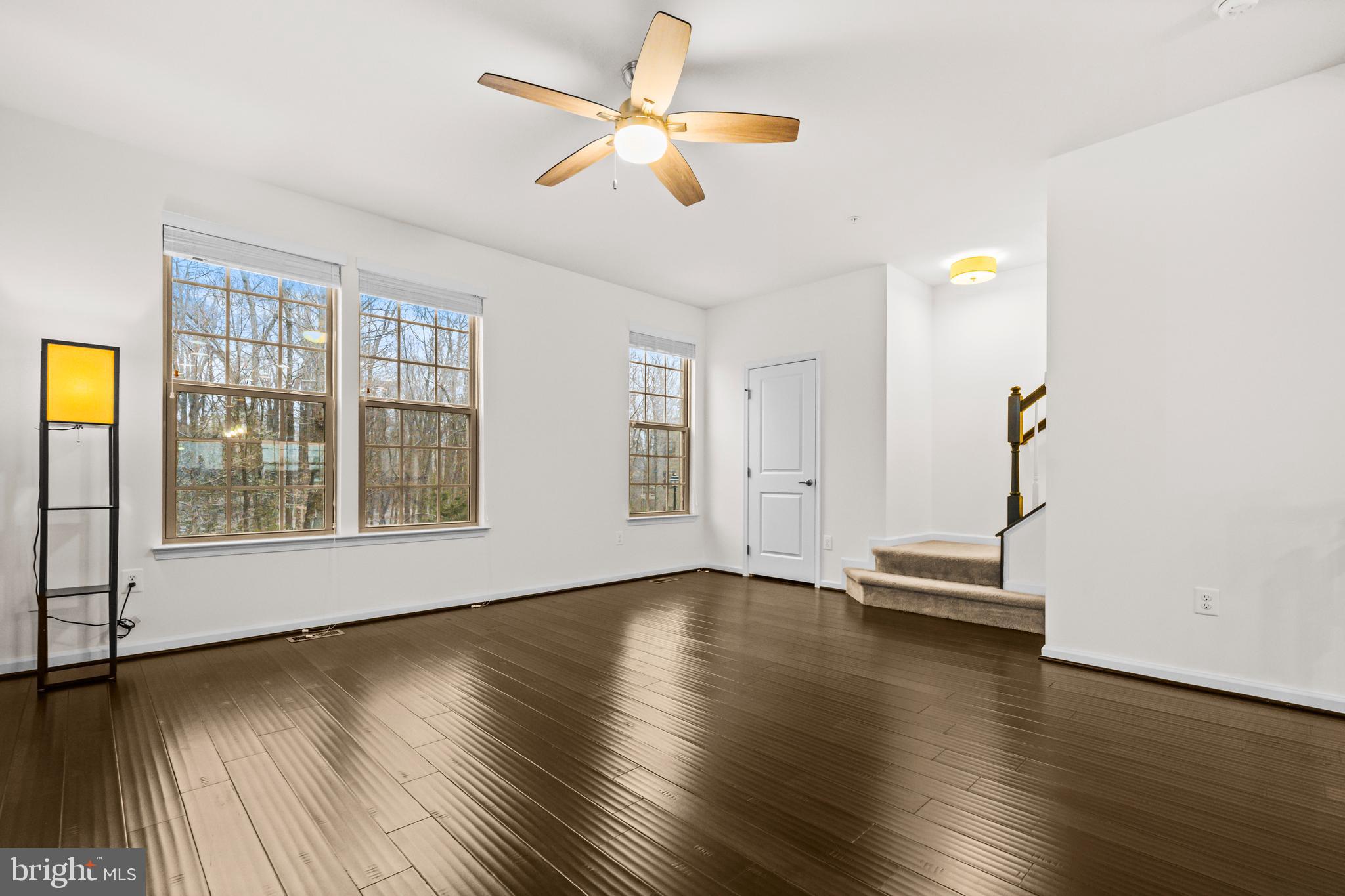 7839 Patterson Way Hanover, MD 21076 - Photo 9 of 56 a view of empty room with wooden floor and fan