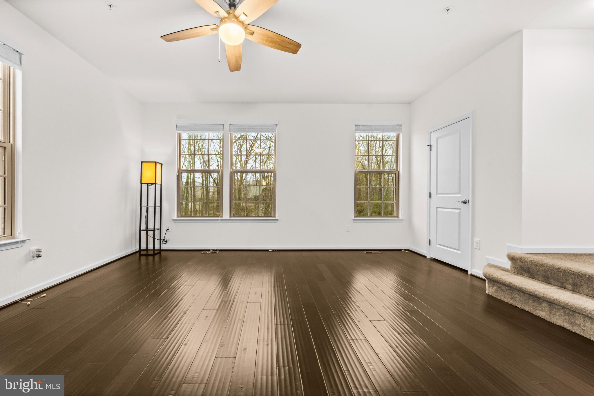 7839 Patterson Way Hanover, MD 21076 - Photo 10 of 56 a view of an empty room with wooden floor and a window