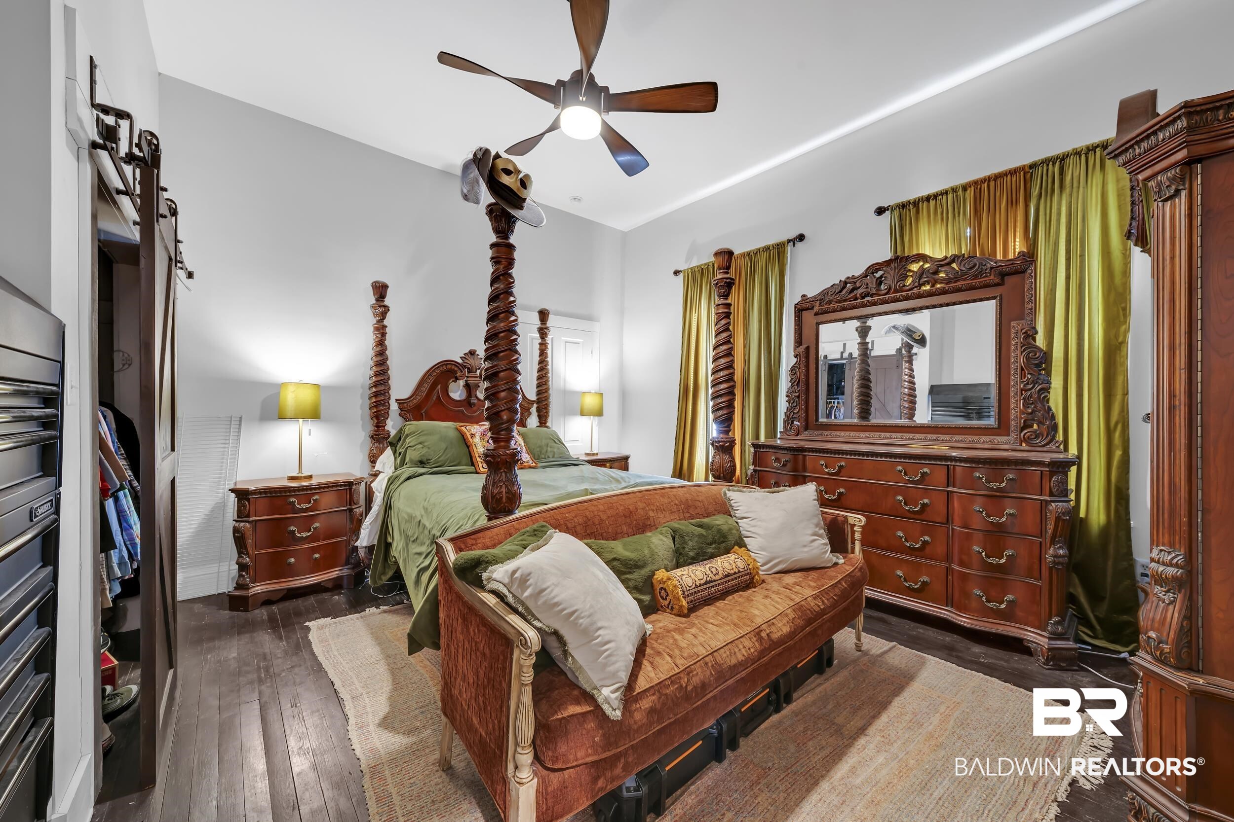 1322 Dauphin Street Mobile, AL 36604 - Photo 13 of 21 Bedroom featuring ceiling fan and dark wood-type flooring