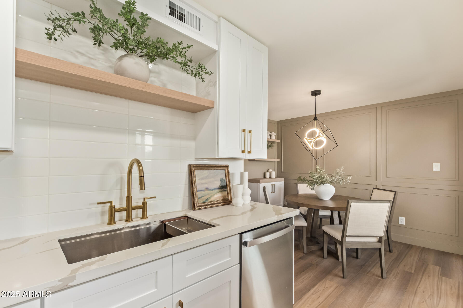 4201 East Camelback Road, Unit 14 Phoenix, AZ 85018 - Photo 11 of 26 a kitchen with a sink cabinets and wooden floor