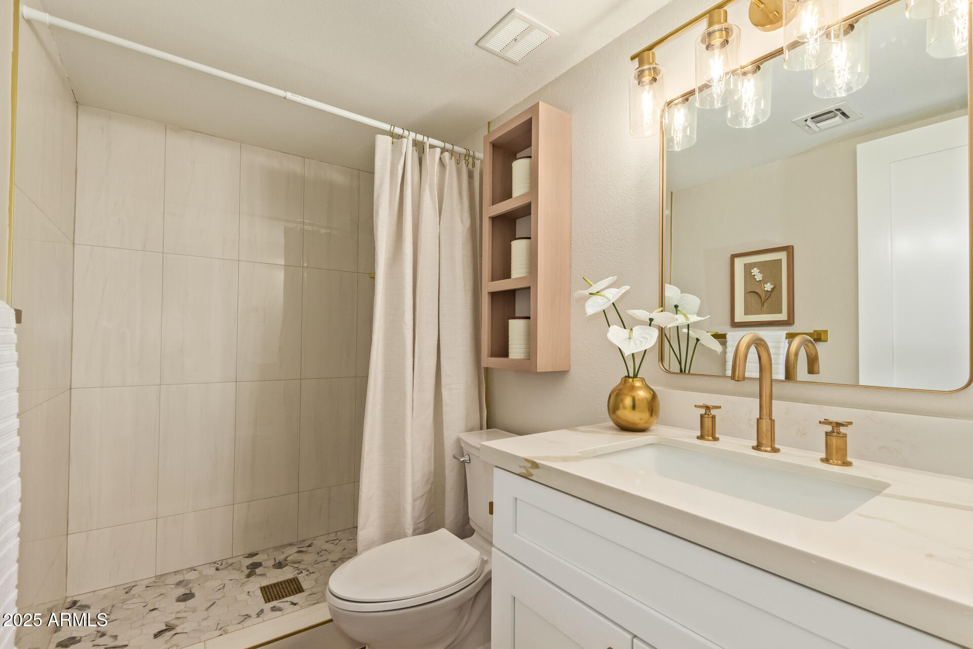 4201 East Camelback Road, Unit 14 Phoenix, AZ 85018 - Photo 15 of 26 a bathroom with a granite countertop sink a toilet a mirror and shower