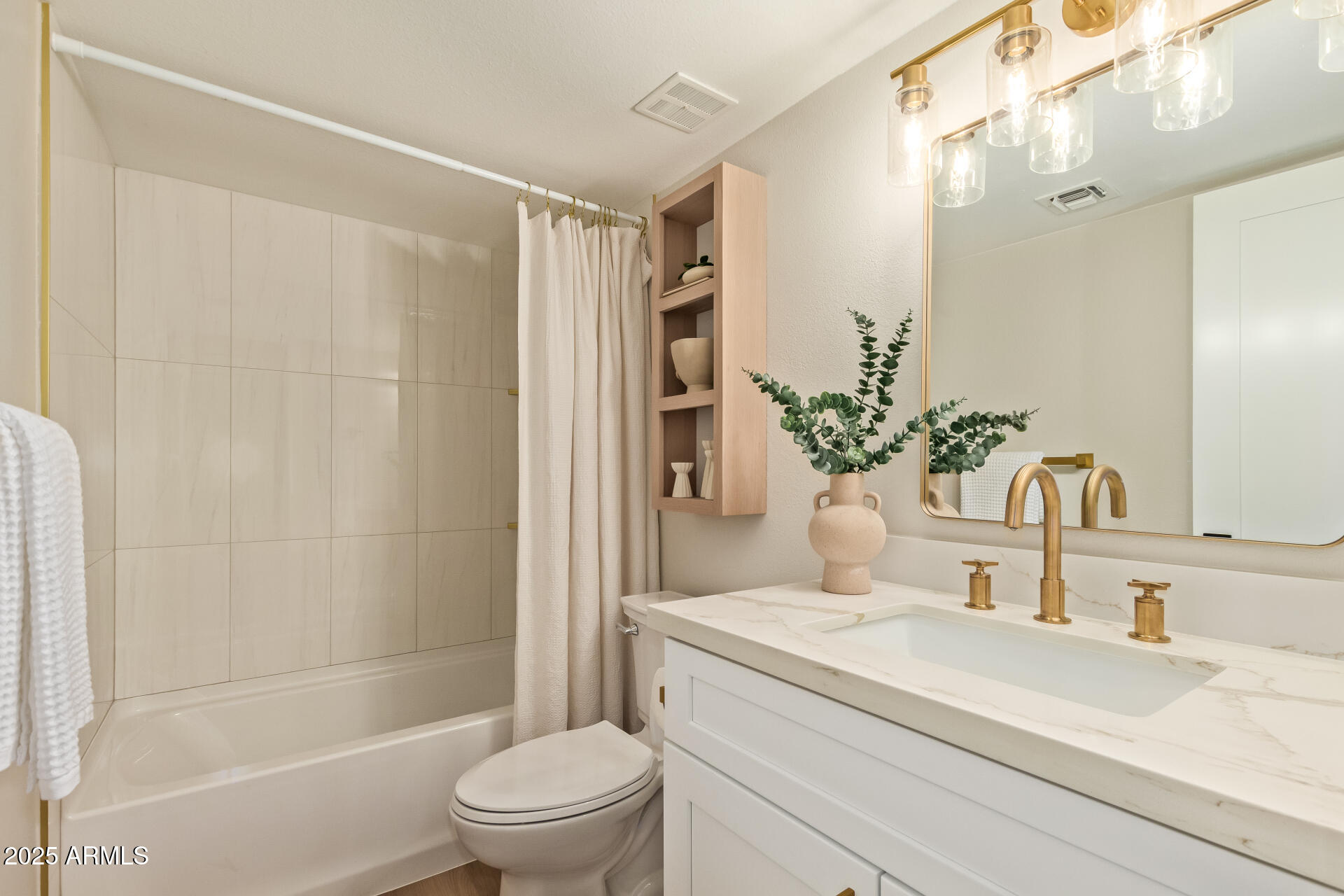 4201 East Camelback Road, Unit 14 Phoenix, AZ 85018 - Photo 19 of 26 a bathroom with a granite countertop sink a toilet and shower
