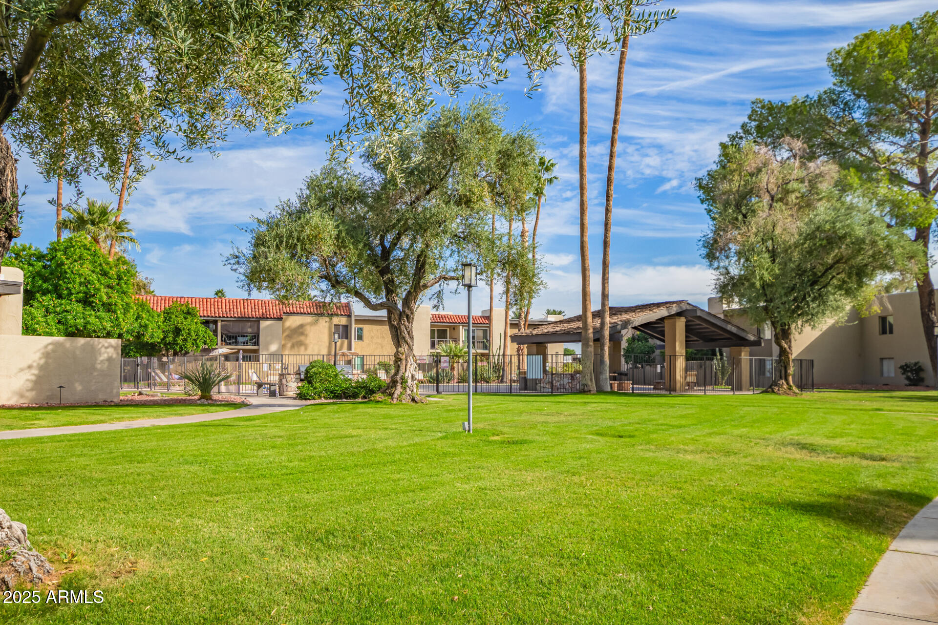 4201 East Camelback Road, Unit 14 Phoenix, AZ 85018 - Photo 24 of 26 a view of a building with a yard