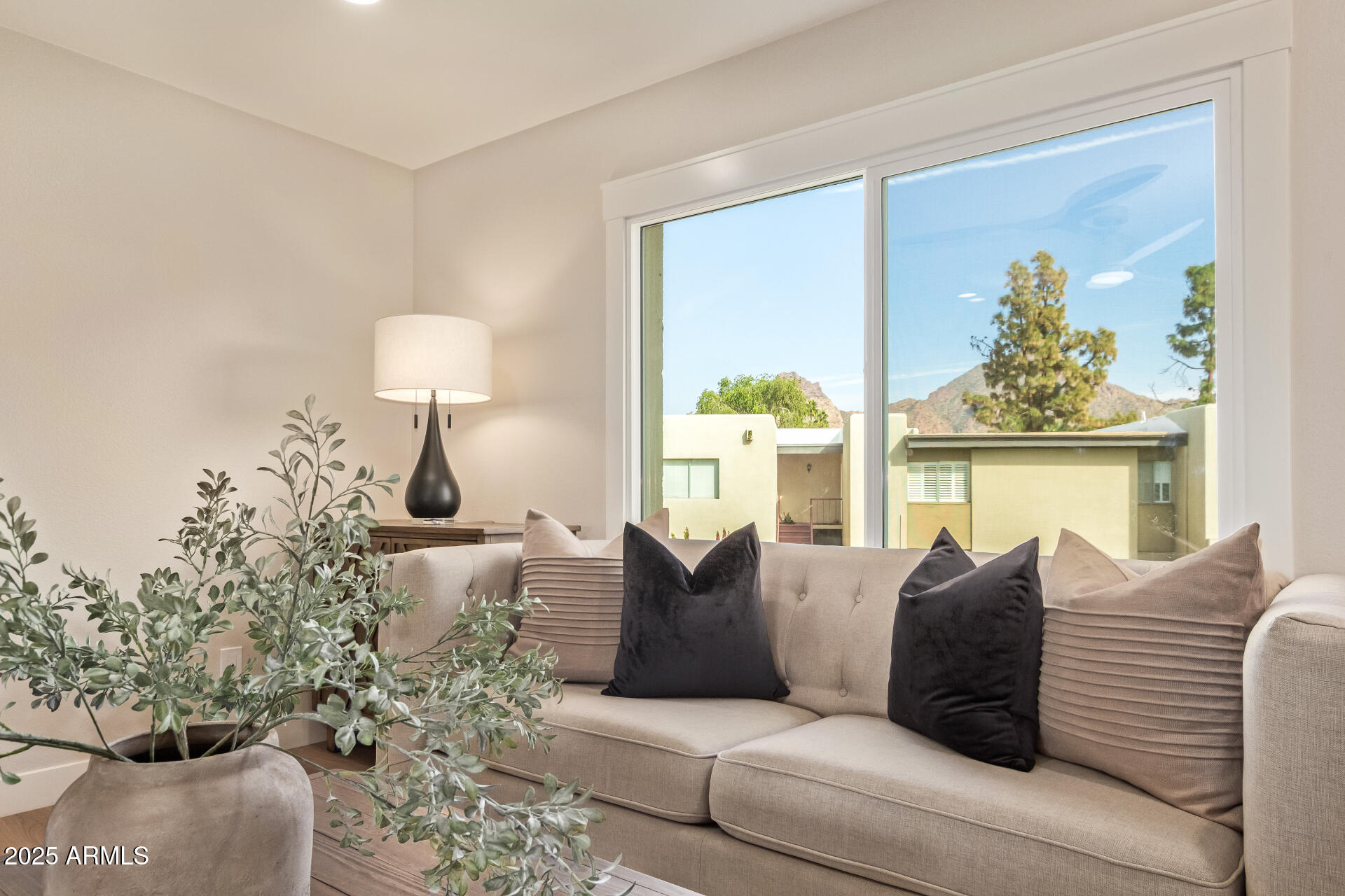 4201 East Camelback Road, Unit 14 Phoenix, AZ 85018 - Photo 5 of 26 a living room with furniture and a window