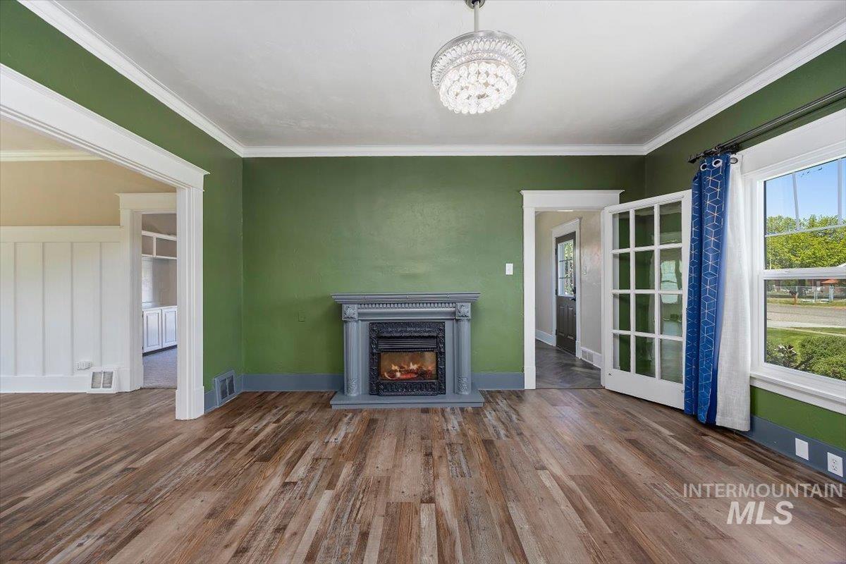 813 7th Street Rupert, ID 83350 - Photo 10 of 48 Living area featuring wood-finish flooring and a decorative electric fireplace
