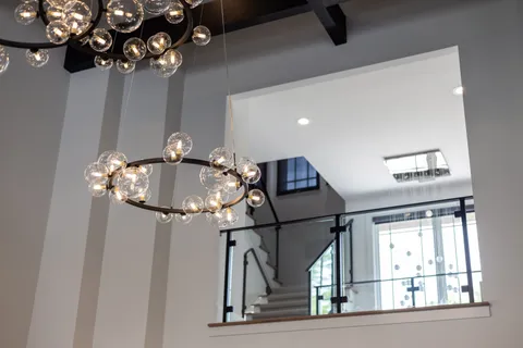 a living room with furniture and a floor to ceiling window