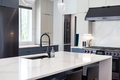 a view of deck with table and chairs potted plants with wooden floor and fence