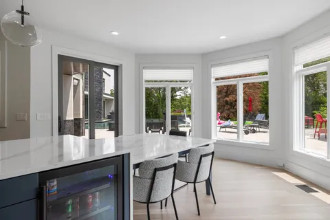 a view of a patio with swimming pool table and chairs