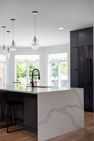 an aerial view of a house with a lake view