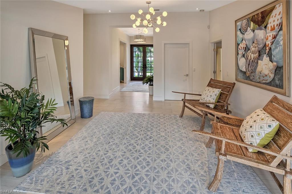 159 Conners Avenue Naples, FL 34108 - Photo 11 of 35 a living room with furniture flowerpot and wooden floor