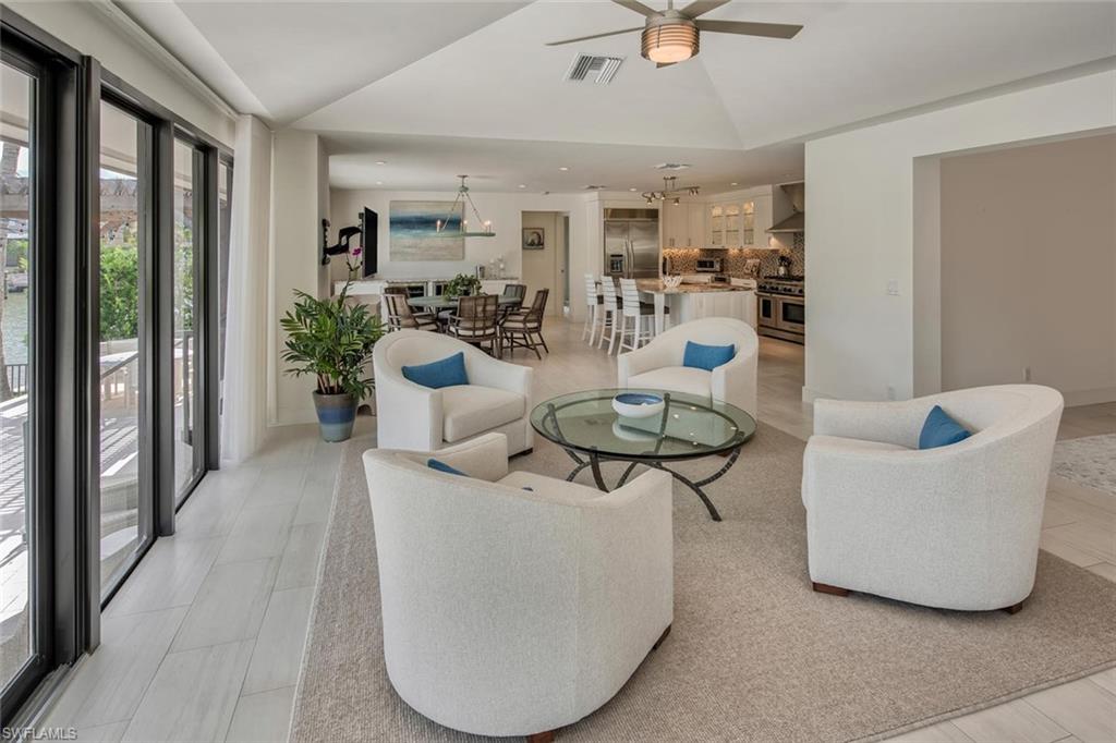 159 Conners Avenue Naples, FL 34108 - Photo 15 of 35 a living room with furniture and a large window