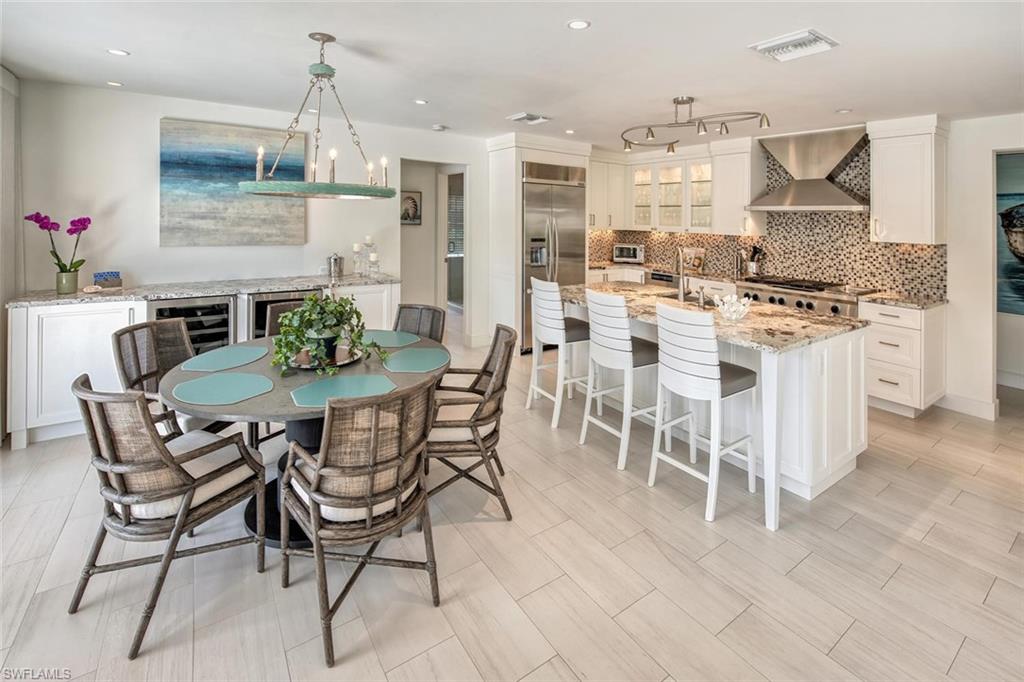 159 Conners Avenue Naples, FL 34108 - Photo 16 of 35 a view of a dining room with furniture