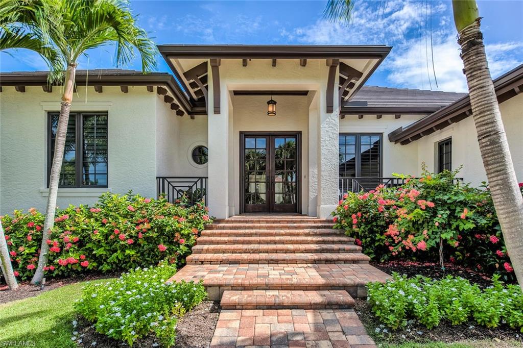 159 Conners Avenue Naples, FL 34108 - Photo 3 of 35 a front view of a house with plants