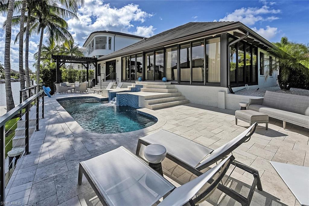 159 Conners Avenue Naples, FL 34108 - Photo 34 of 35 a view of a house with backyard and sitting area