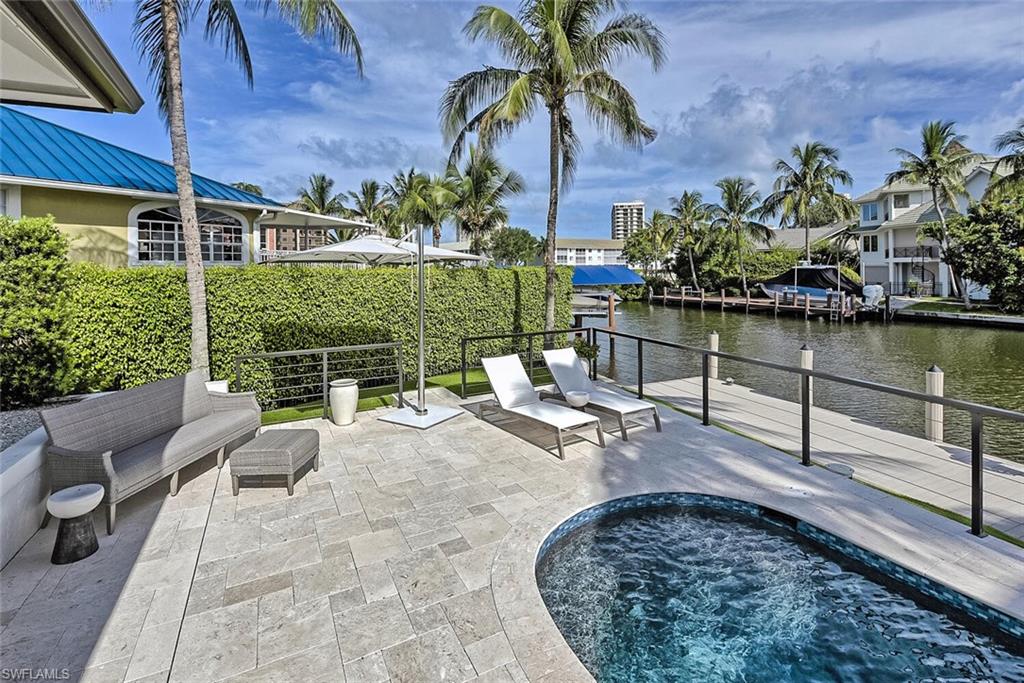 159 Conners Avenue Naples, FL 34108 - Photo 35 of 35 a view of a backyard with sitting area