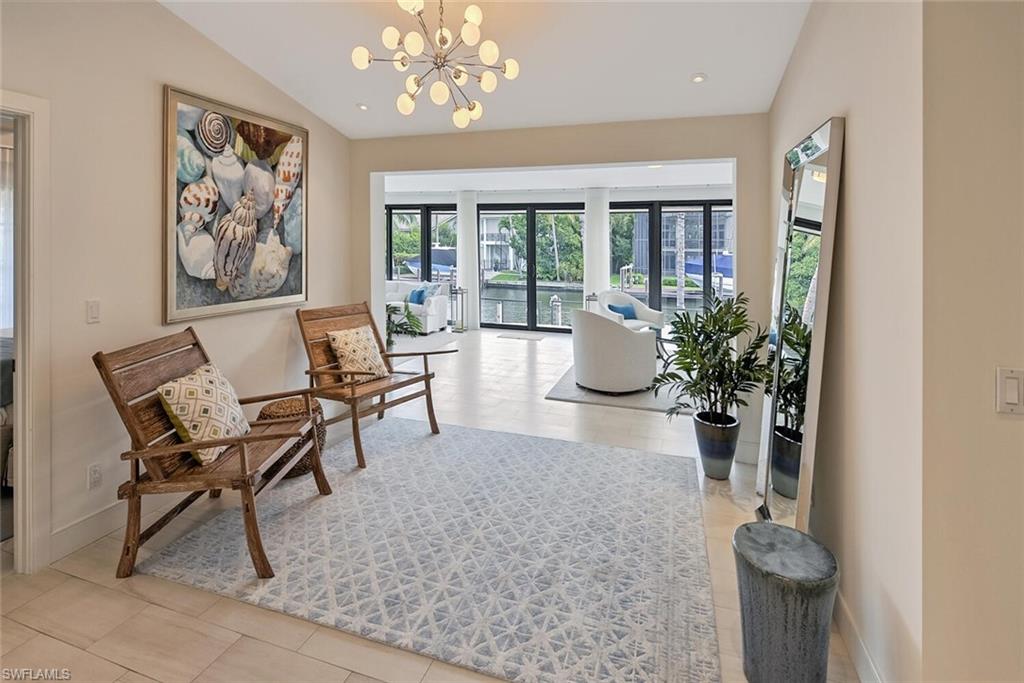 159 Conners Avenue Naples, FL 34108 - Photo 10 of 35 a view of a dining room with furniture window and wooden floor