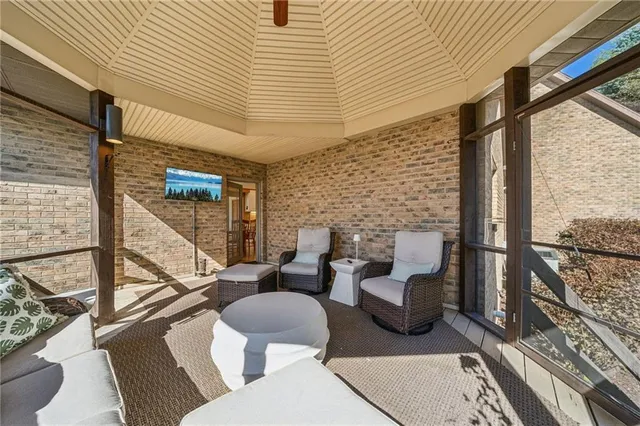 a view of balcony with chairs and wooden floor