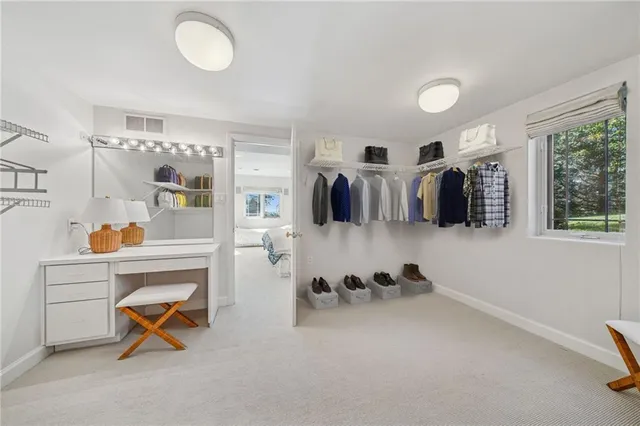 a bedroom with a bed and dresser