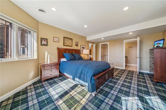 a living room with a bed and furniture