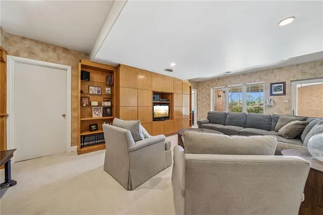 a room with furniture and pool table