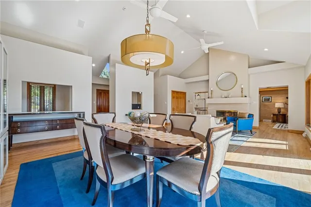 a view of a dining room with furniture wooden floor and front door