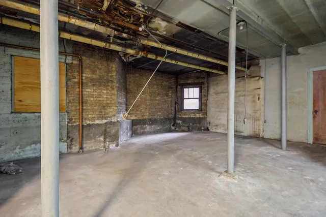 a view of an empty room with wooden walls
