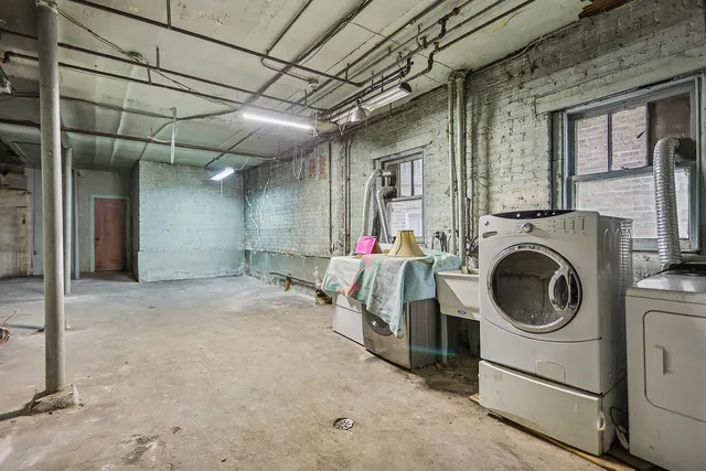 a view of a hallway with washer and dryer