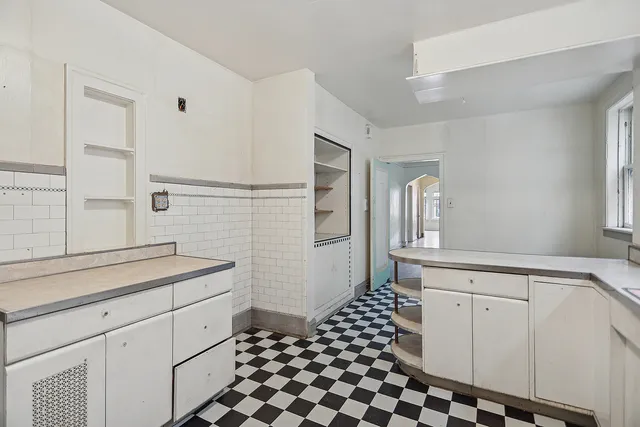 a kitchen with a sink and cabinets
