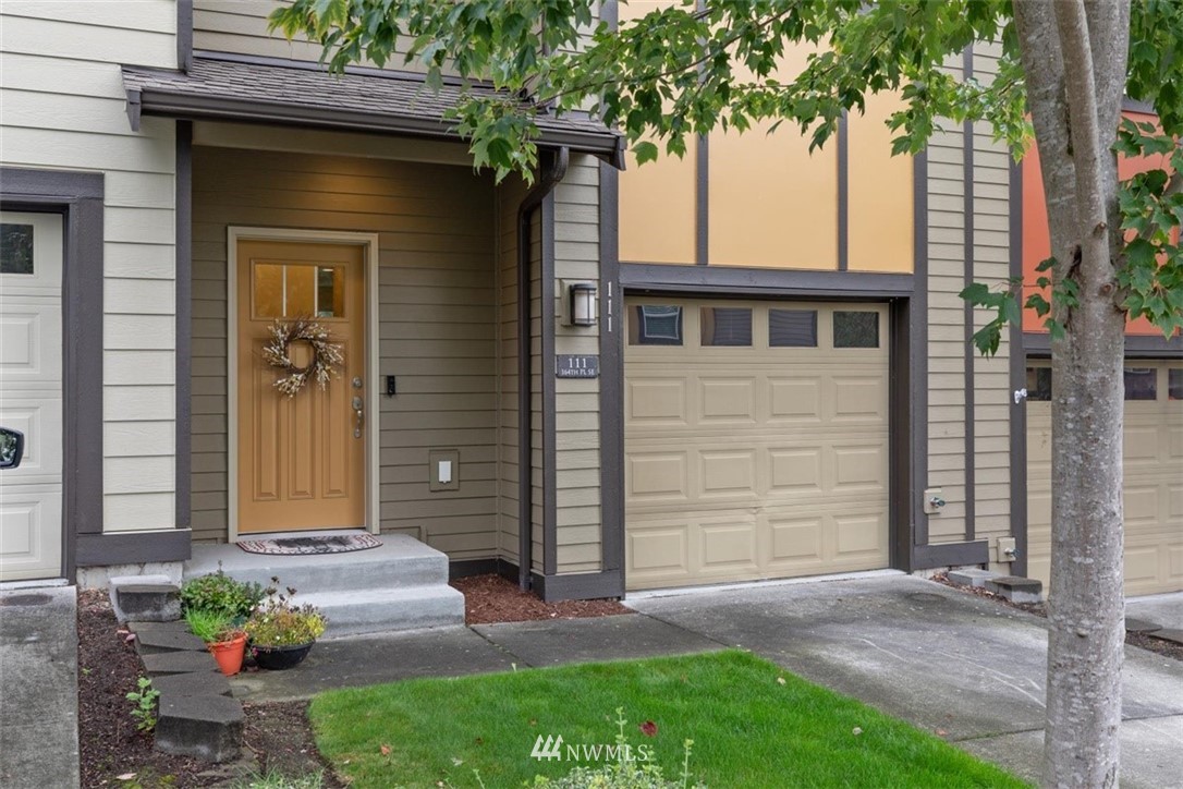 111 164th Place Southeast Bothell, WA 98012 - Photo 2 of 27 a front view of a house with a garden