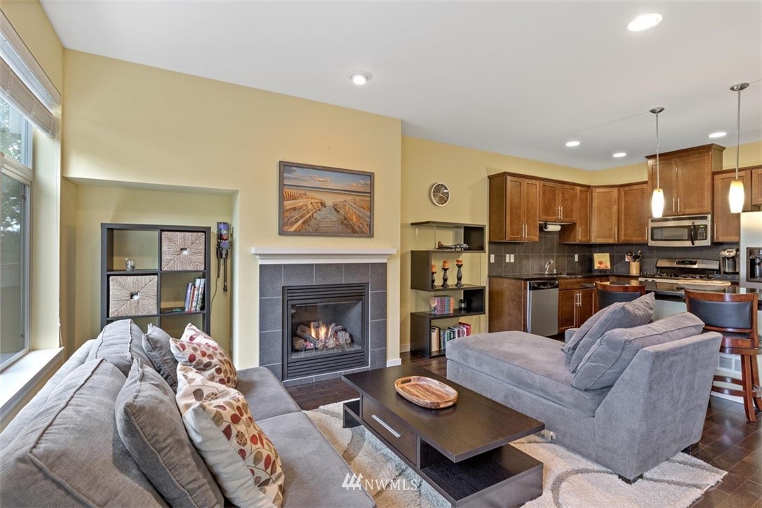 111 164th Place Southeast Bothell, WA 98012 - Photo 11 of 27 a living room with furniture and a fireplace