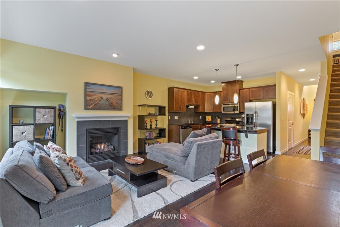 111 164th Place Southeast Bothell, WA 98012 - Photo 12 of 27 a living room with furniture and a fireplace