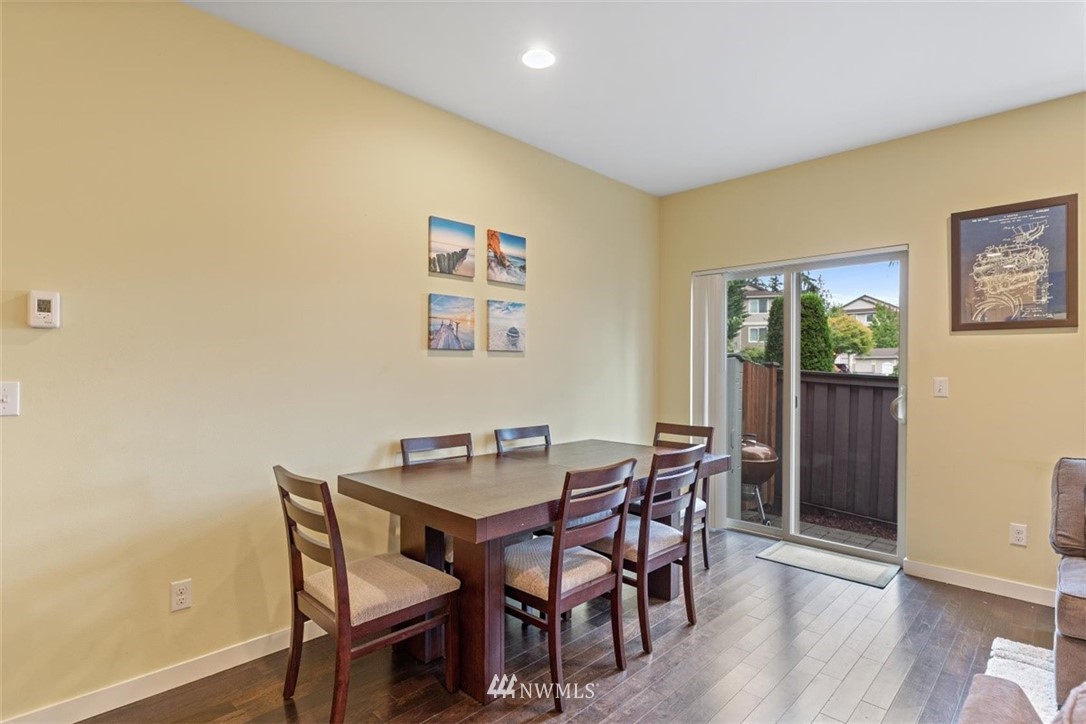 111 164th Place Southeast Bothell, WA 98012 - Photo 13 of 27 a view of a dining room with furniture and wooden floor