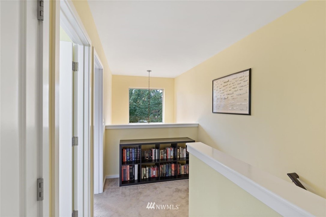 111 164th Place Southeast Bothell, WA 98012 - Photo 15 of 27 a view of a hallway with wooden floor and a window