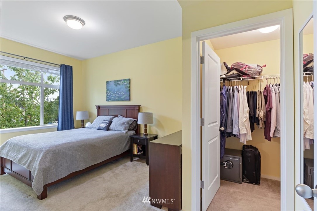 111 164th Place Southeast Bothell, WA 98012 - Photo 16 of 27 a bedroom with a bed and a painting on the wall