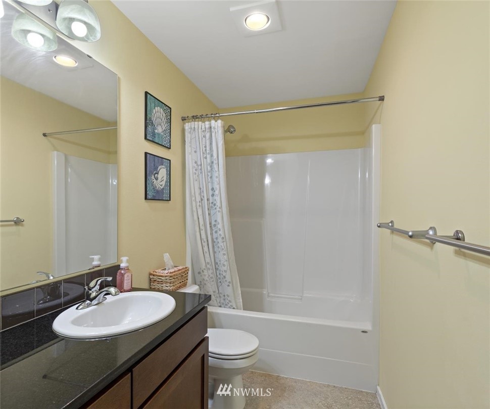 111 164th Place Southeast Bothell, WA 98012 - Photo 21 of 27 a bathroom with a sink a toilet and shower