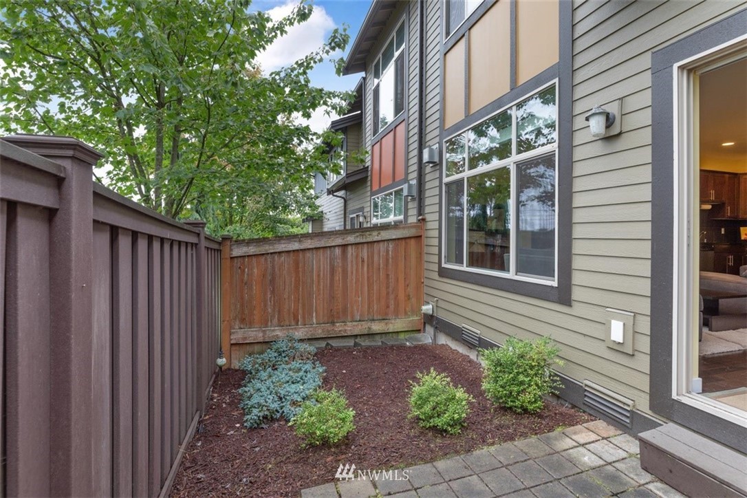 111 164th Place Southeast Bothell, WA 98012 - Photo 23 of 27 a view of a house with a yard and wooden fence