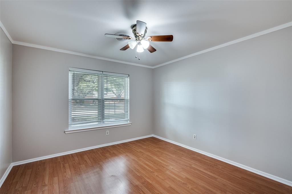 1428 Pamela Street Hurst, TX 76053 - Photo 14 of 25 a view of an empty room with wooden floor and a window