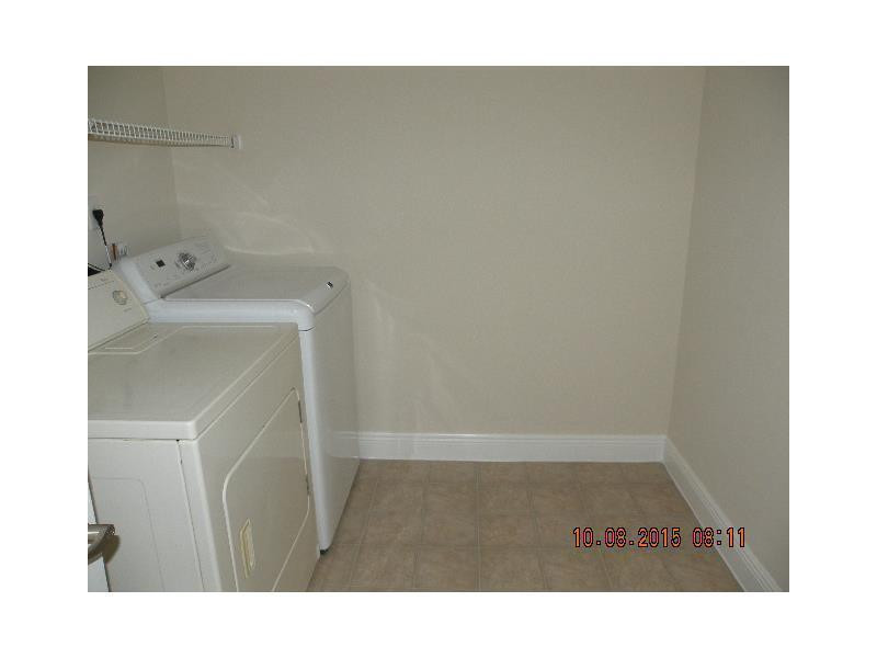 5760 Rock Island Road, Unit 328 Tamarac, FL 33319 - Photo 6 of 16 a bathroom with a sink and a mirror