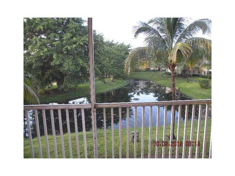 5760 Rock Island Road, Unit 328 Tamarac, FL 33319 - Photo 8 of 16 a view of a balcony with lake view
