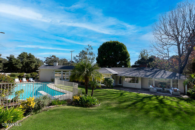 14401 Villa Woods Place Pacific Palisades, CA 90272 - Photo 1 of 46 a view of a house with a big yard potted plants and a large tree