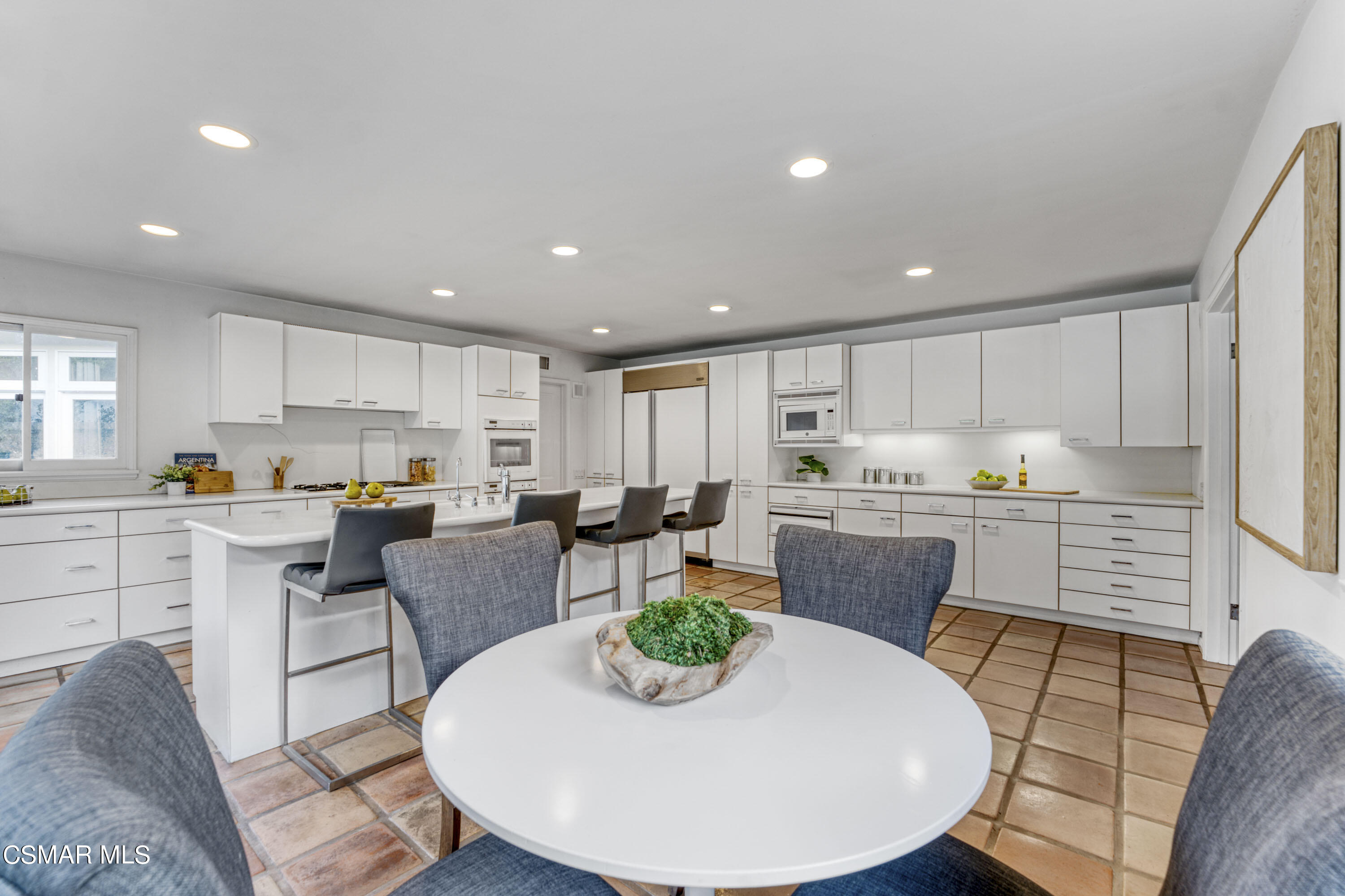 14401 Villa Woods Place Pacific Palisades, CA 90272 - Photo 11 of 46 a view of kitchen with dining table and chairs