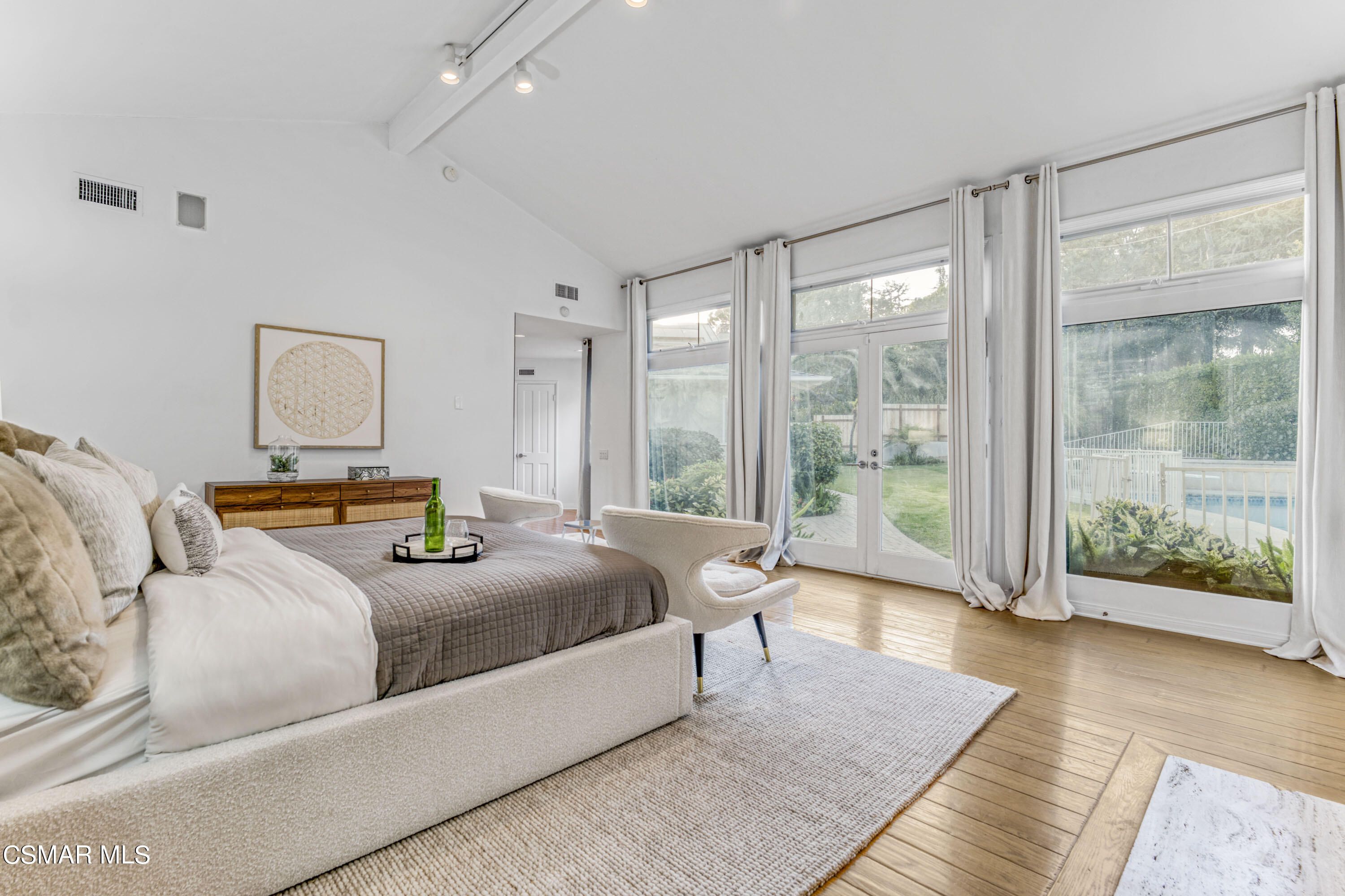 14401 Villa Woods Place Pacific Palisades, CA 90272 - Photo 13 of 46 a bedroom with a large bed and large window
